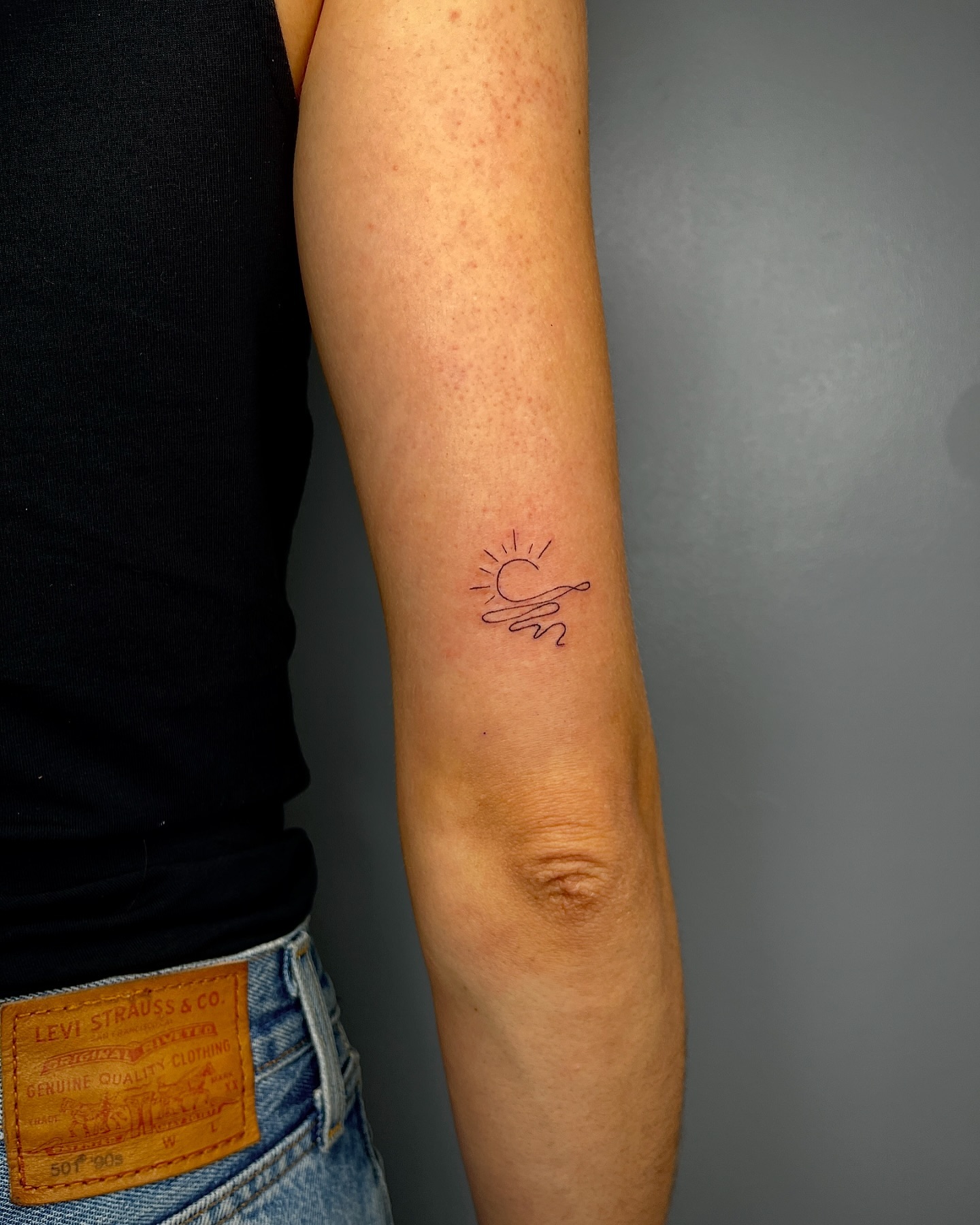 Delicate Fine Line Sunrise on Inner Forearm sunrise tattoo