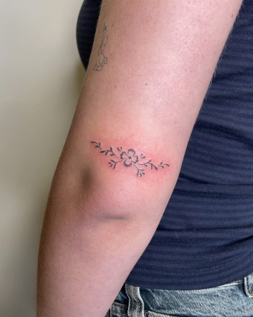 Delicate Floral Elbow Tattoo