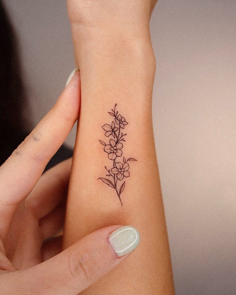 Delicate Floral Line Art Tattoo flower wrist tattoo ideas tattoo