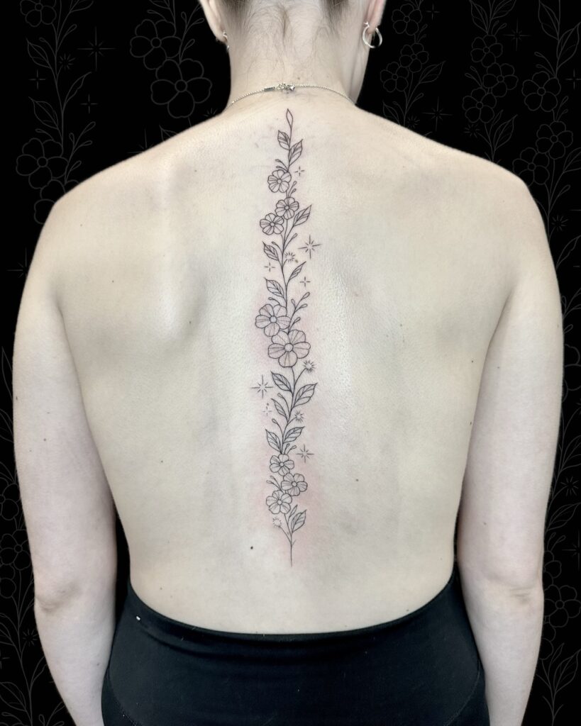 Delicate Floral Spine Tattoo