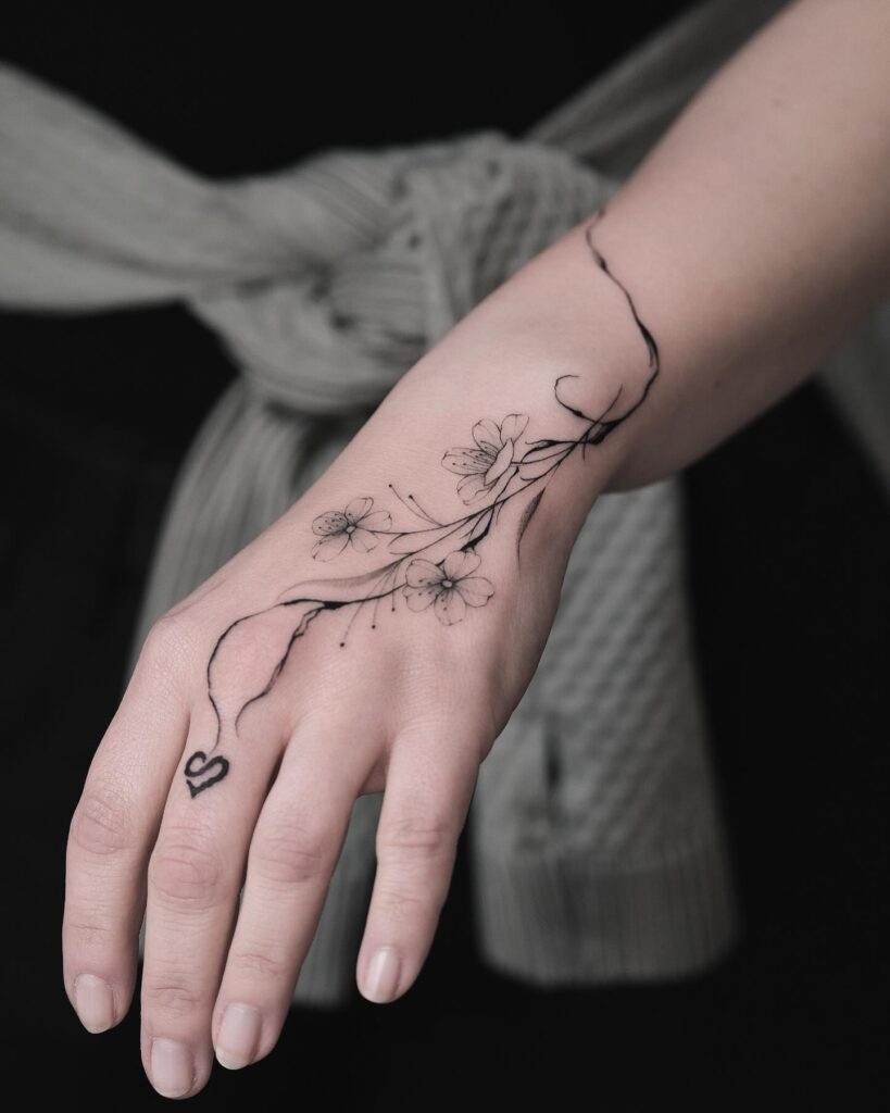 Botanical Elegance Hand Tattoo
