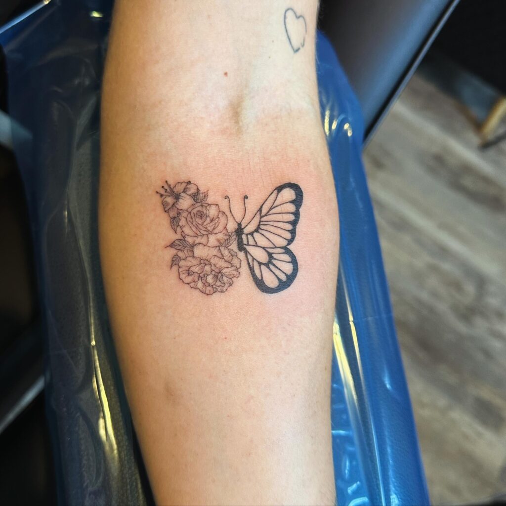 Delicate Fusion Butterfly Tattoo half butterfly half flower tattoos tattoo