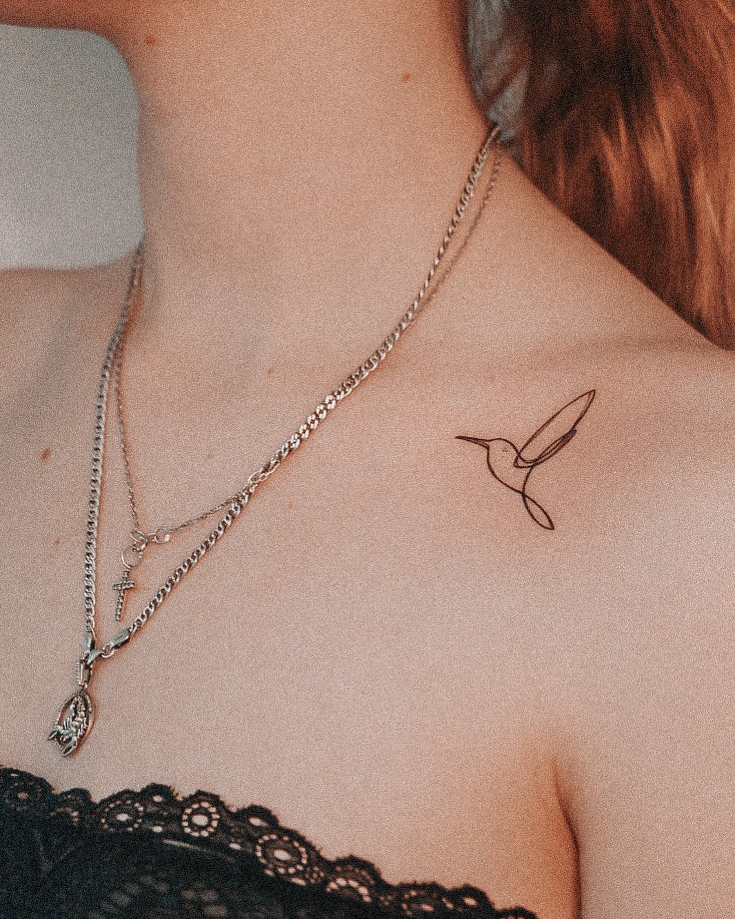 One line hummingbird tattoo with extended beak