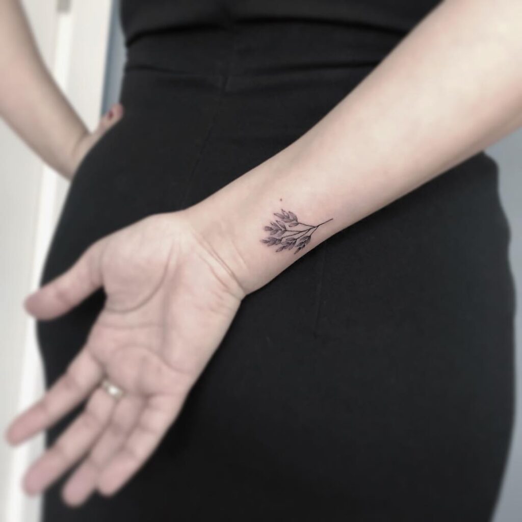 Delicate Leaf Wrist Tattoo minimal tiny flower tattoo ideas tattoo