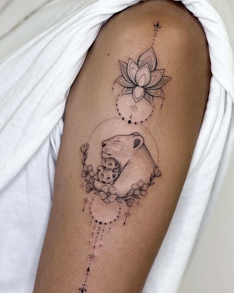 Delicate Lioness and Cubs with Lotus Tattoo mommy tattoo ideas tattoo
