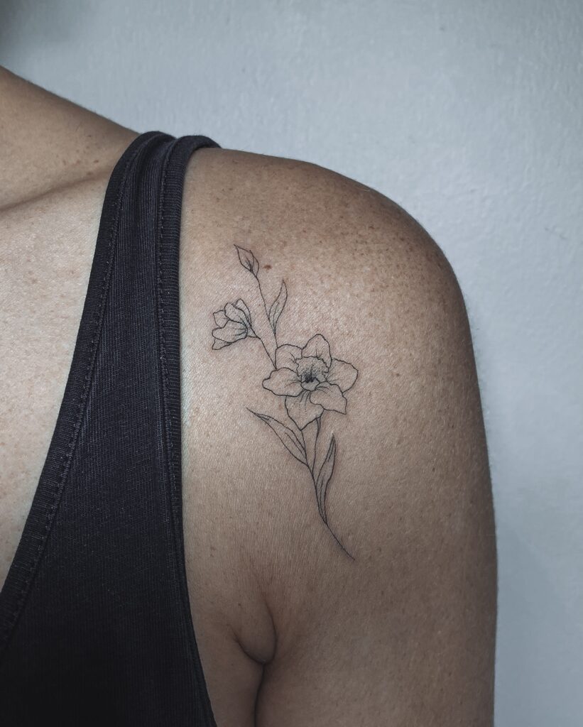 Delicate Narcissus Shoulder Tattoo december birth flower tattoo ideas tattoo