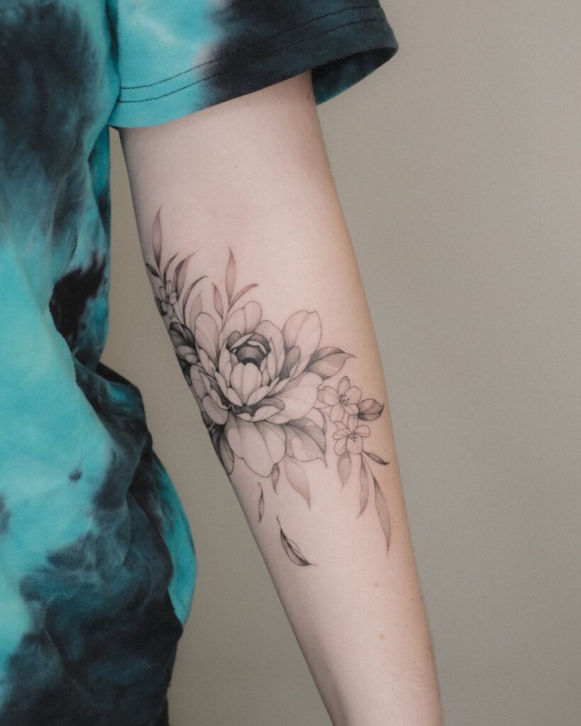 Delicate Peony Forearm Tattoo with Soft Shading peony flower tattoo ideas tattoo