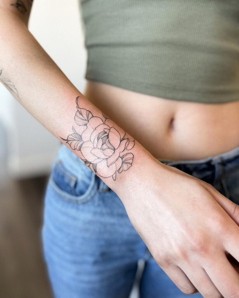 Delicate Peony Wrist Wrap Tattoo flower wrist tattoo ideas tattoo
