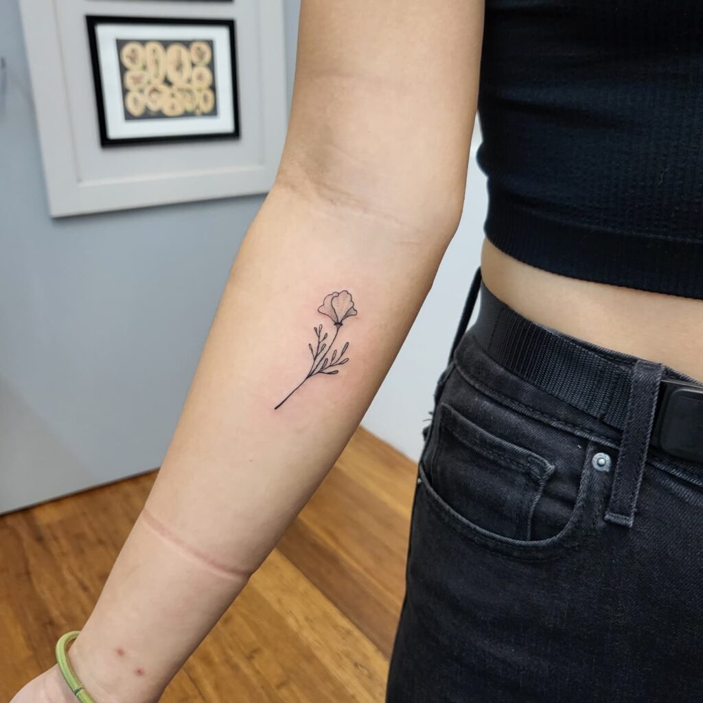 Delicate Poppy Stem Tattoo minimal tiny flower tattoo ideas tattoo