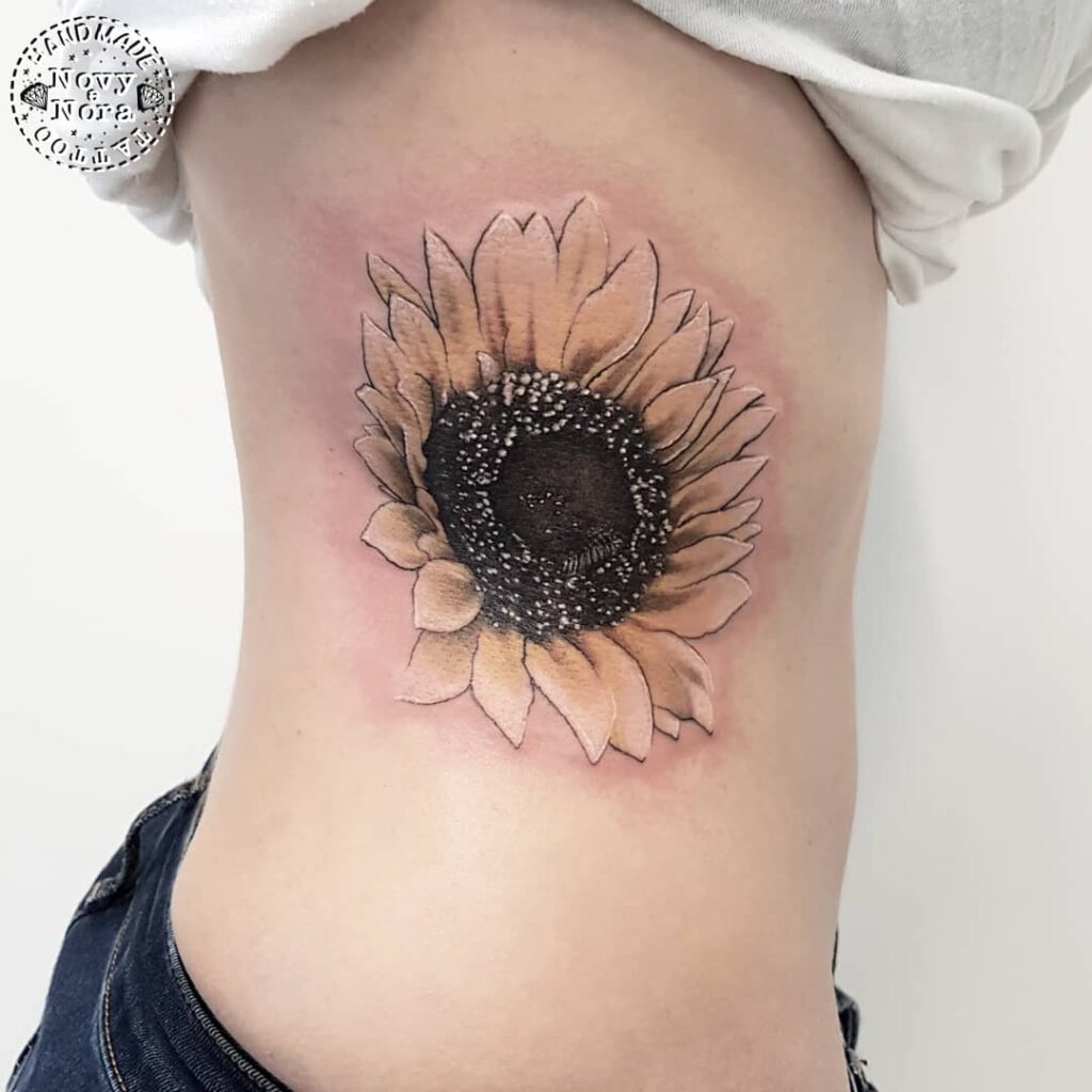 Delicate Ribcage Sunflower Tattoo sunflower tattoos tattoo