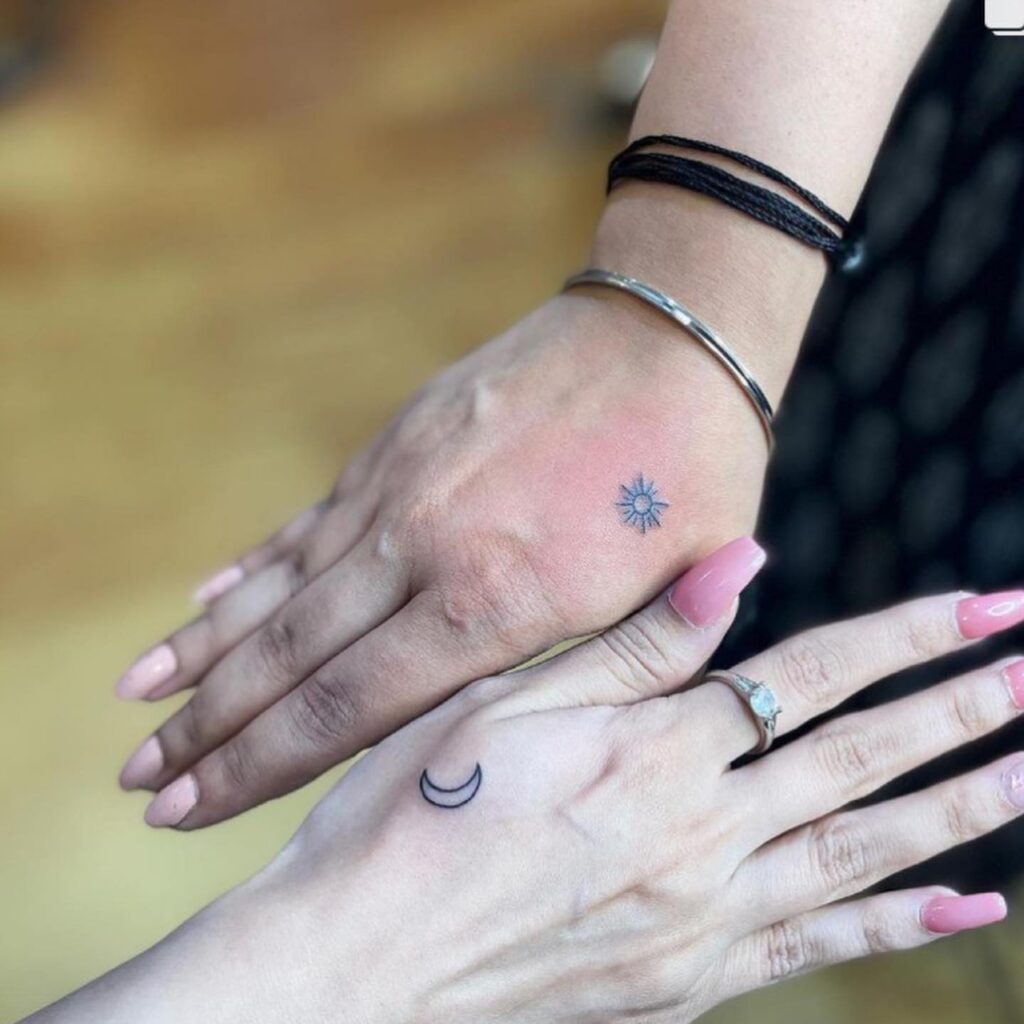 Delicate Sun and Moon Hand Tattoos symbolic sun and moon tattoo ideas tattoo