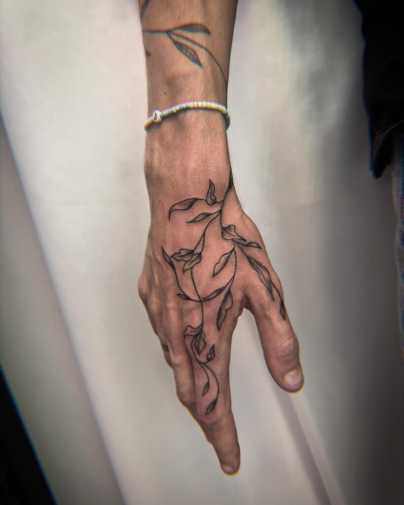Delicate Vine Hand Tattoo hand tattoo ideas for guys tattoo
