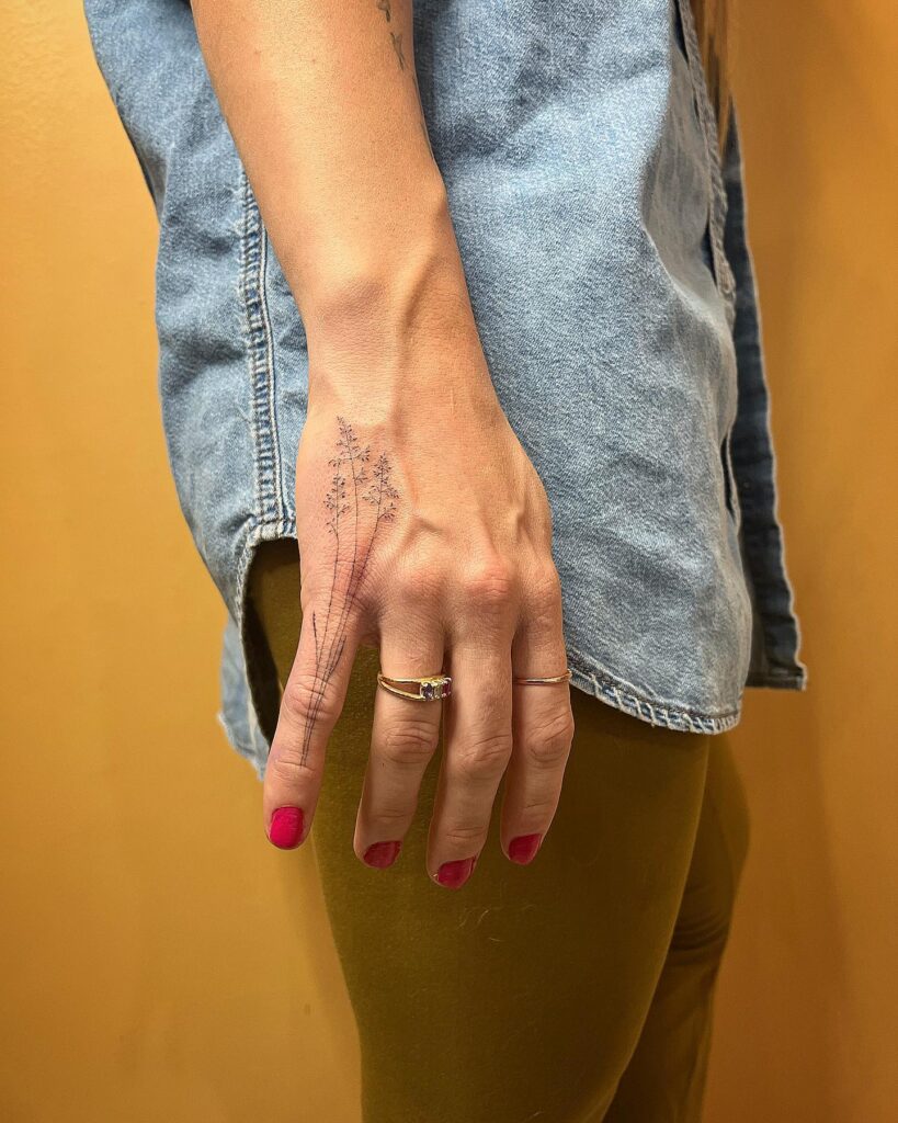 Delicate Celestial And Floral Finger Tattoos
