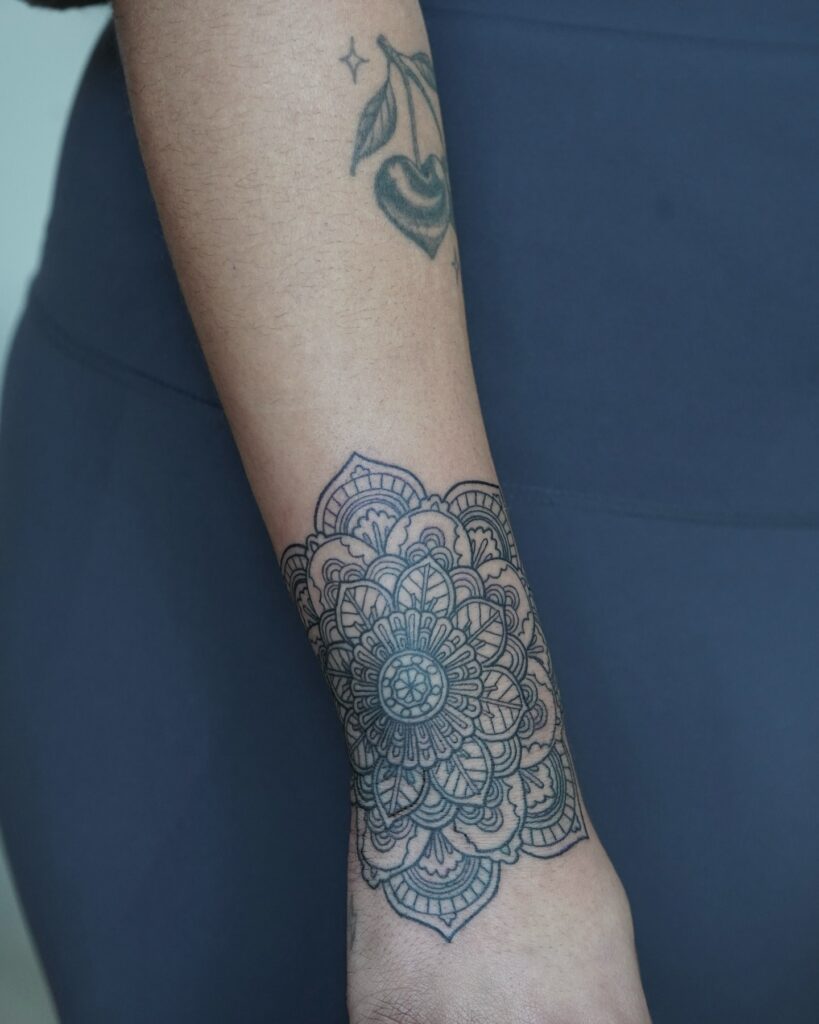 Detailed Mandala Forearm Tattoo with Layered Patterns mandala wrist tattoo ideas tattoo