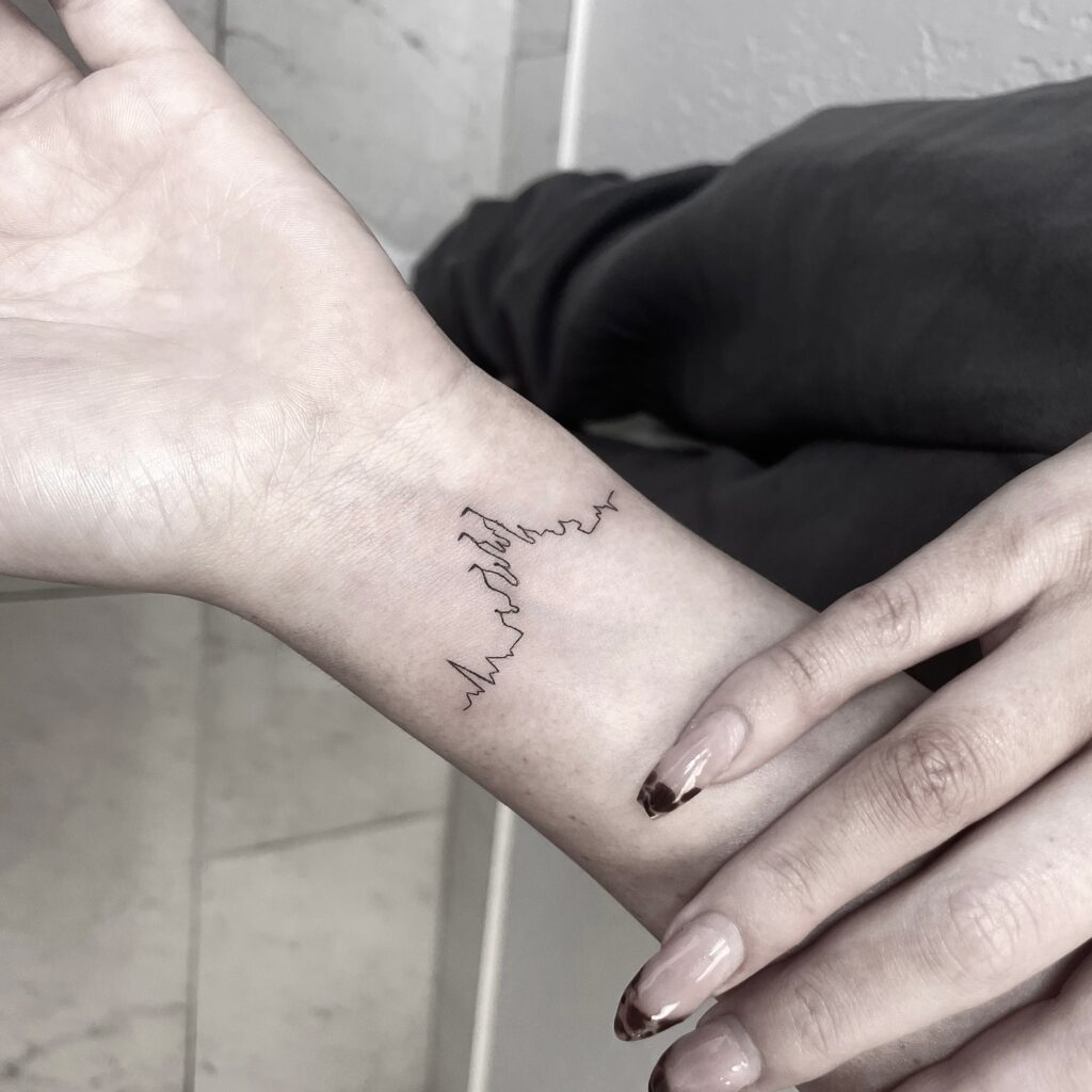 Minimalist Botanical Wrist Tattoo