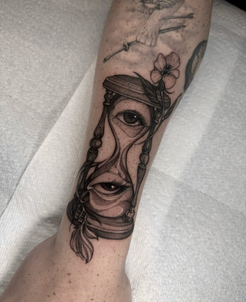 Double Eye Hourglass with Botanical Accents hourglass tattoo ideas tattoo
