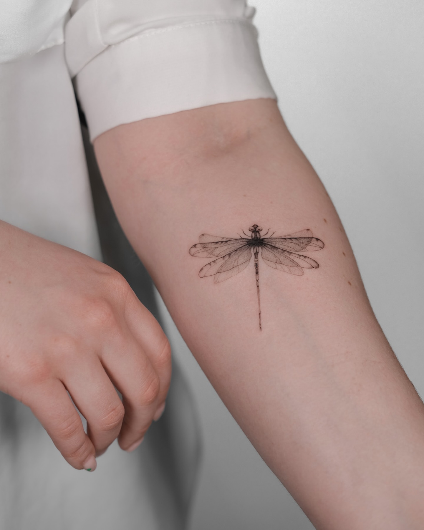 Delicate Fine Line Dragonfly Tattoo