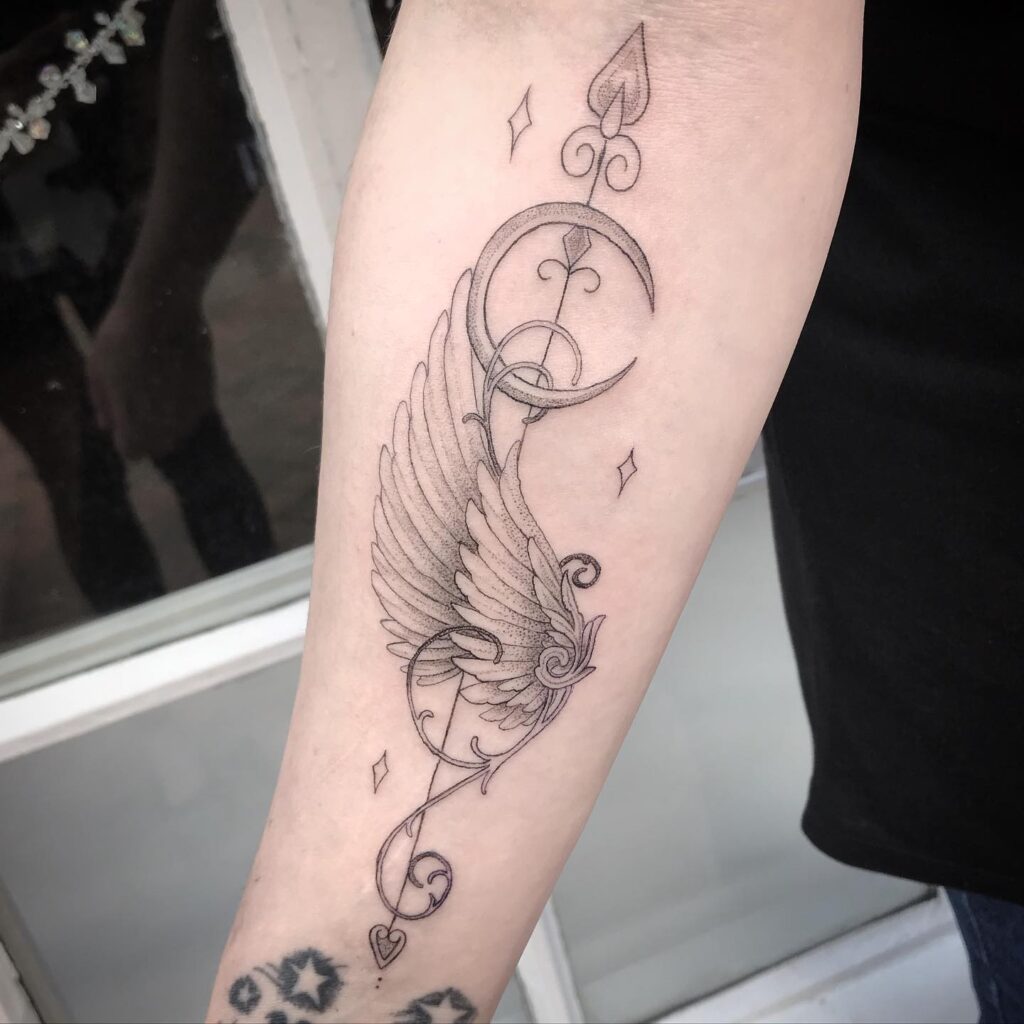 Elegant Angel Wing and Crescent Moon Tattoo angel wings tattoo ideas tattoo