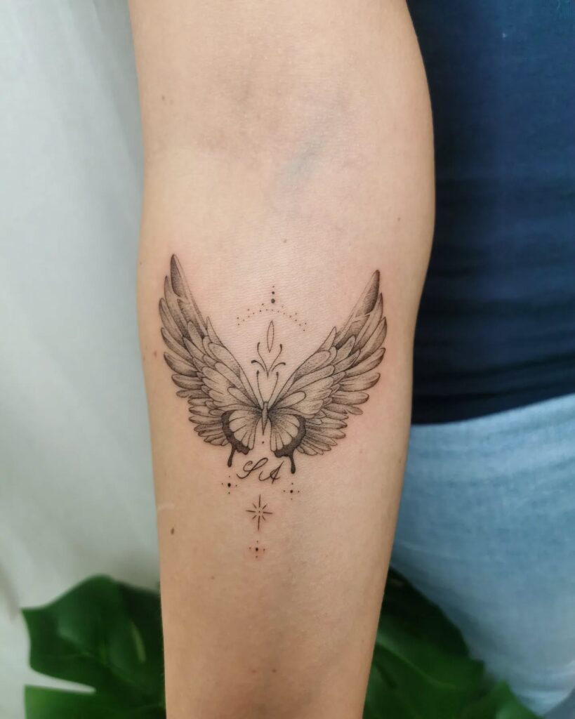 Elegant Butterfly Angel Wings Tattoo with Initials angel wings tattoo ideas tattoo