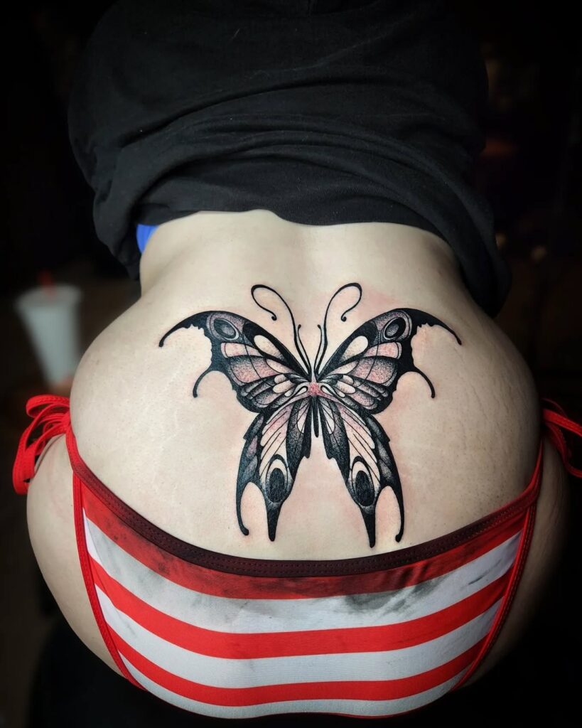 Butterfly With Stars And Heart Lower Back Tattoo