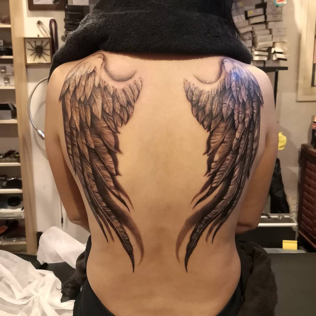 Elegant Curved Angel Wings Back Tattoo angel wings tattoo ideas on back tattoo