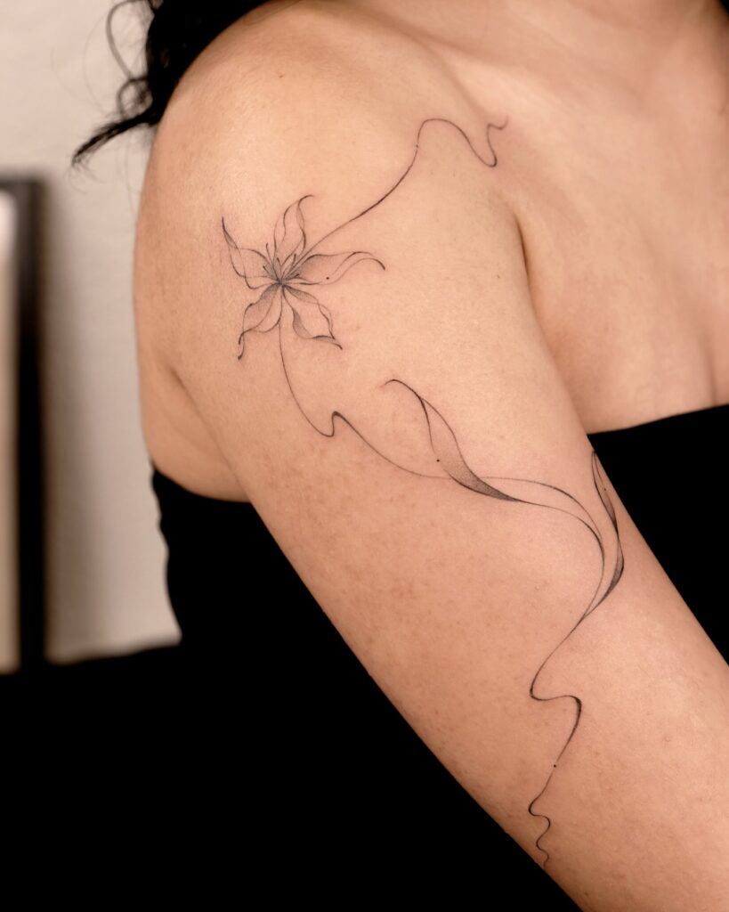 Elegant Fine Line Flower on Shoulder and Arm fine line tattoos for women tattoo