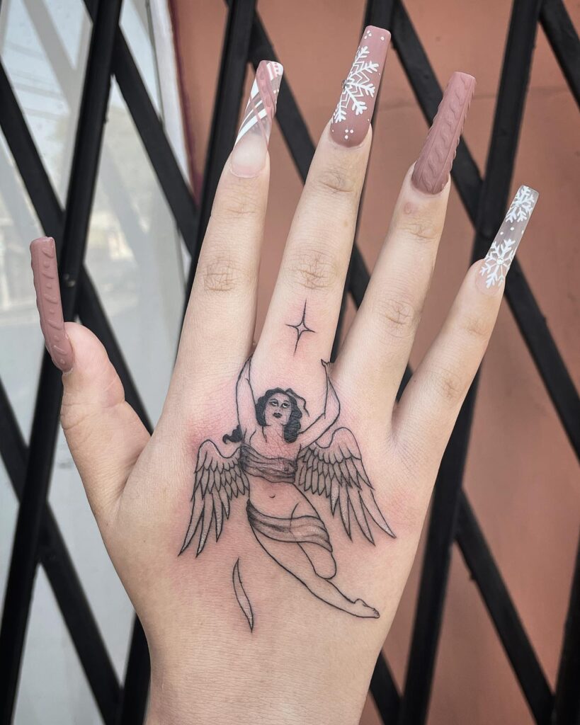 Elegant Flying Angel Hand Tattoo angel tattoo ideas tattoo