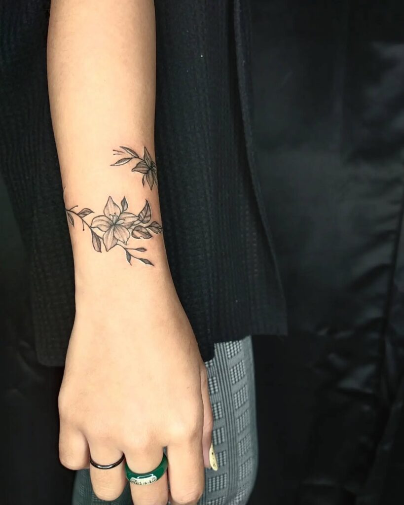 Elegant Lily Wristband Tattoo flower wrist tattoo ideas tattoo