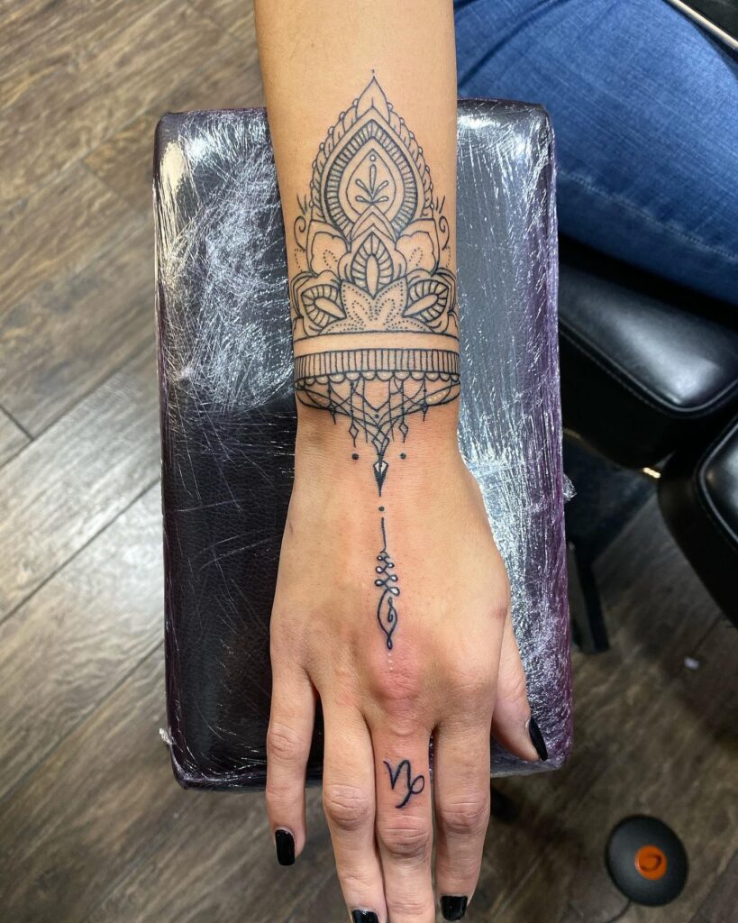 Elegant Mandala Wrist and Hand Tattoo mandala wrist tattoo ideas tattoo