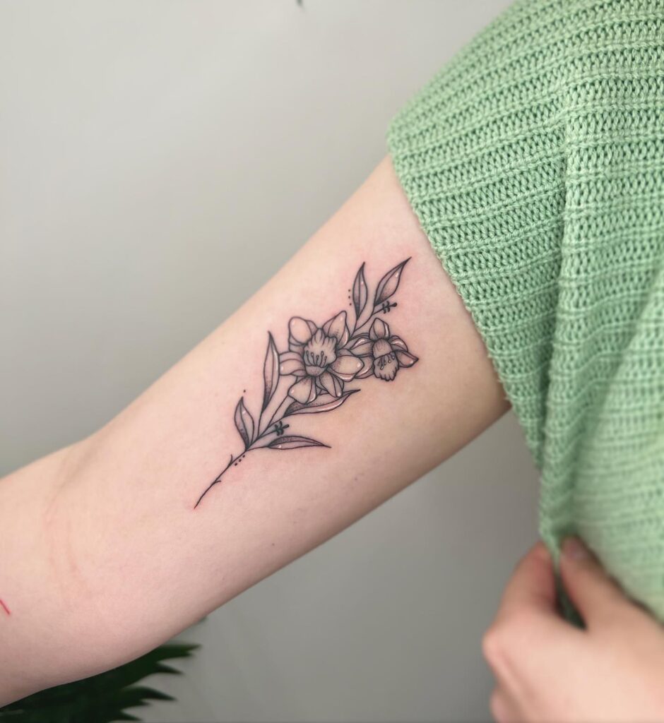 Elegant Narcissus Branch Tattoo december birth flower tattoo ideas tattoo