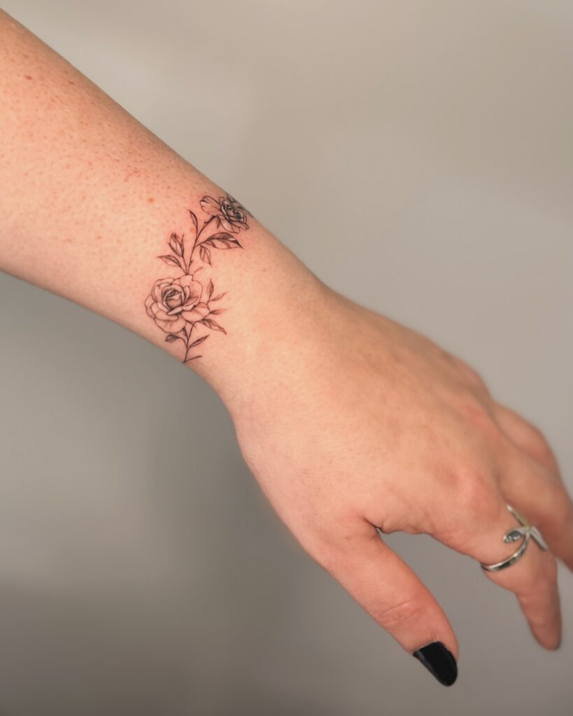Minimalist Initial Wrist Tattoo