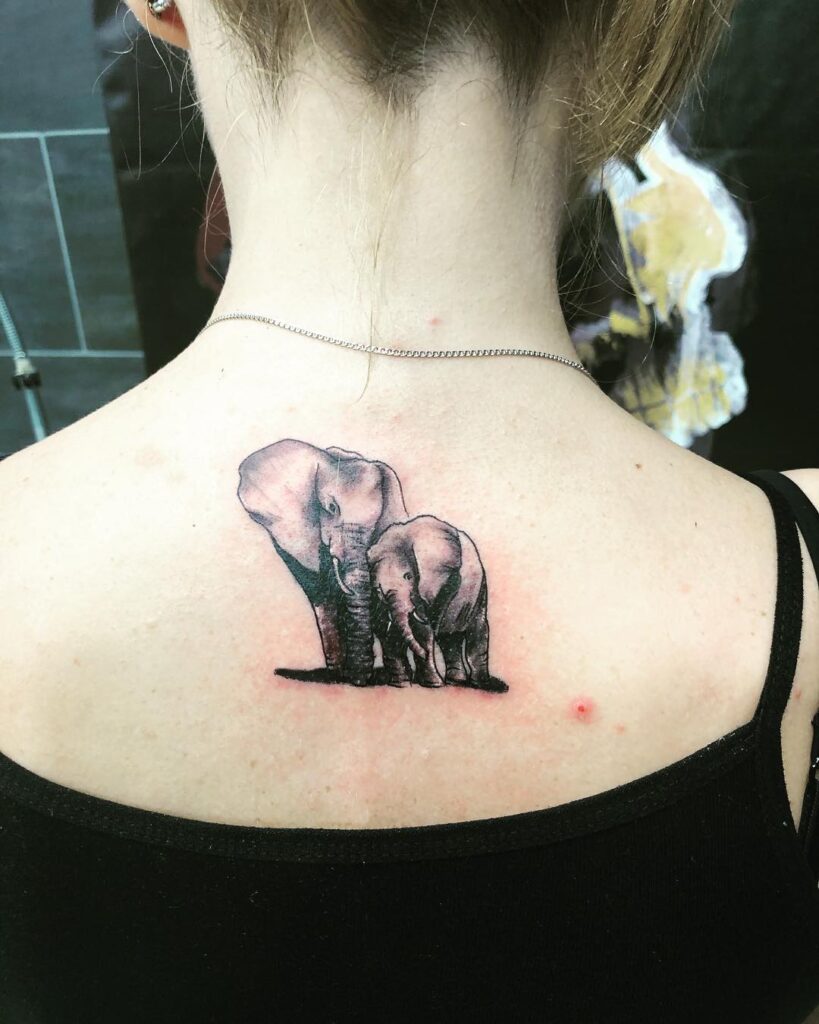 Elephant Parent and Calf Back Tattoo elephant family tattoo ideas tattoo