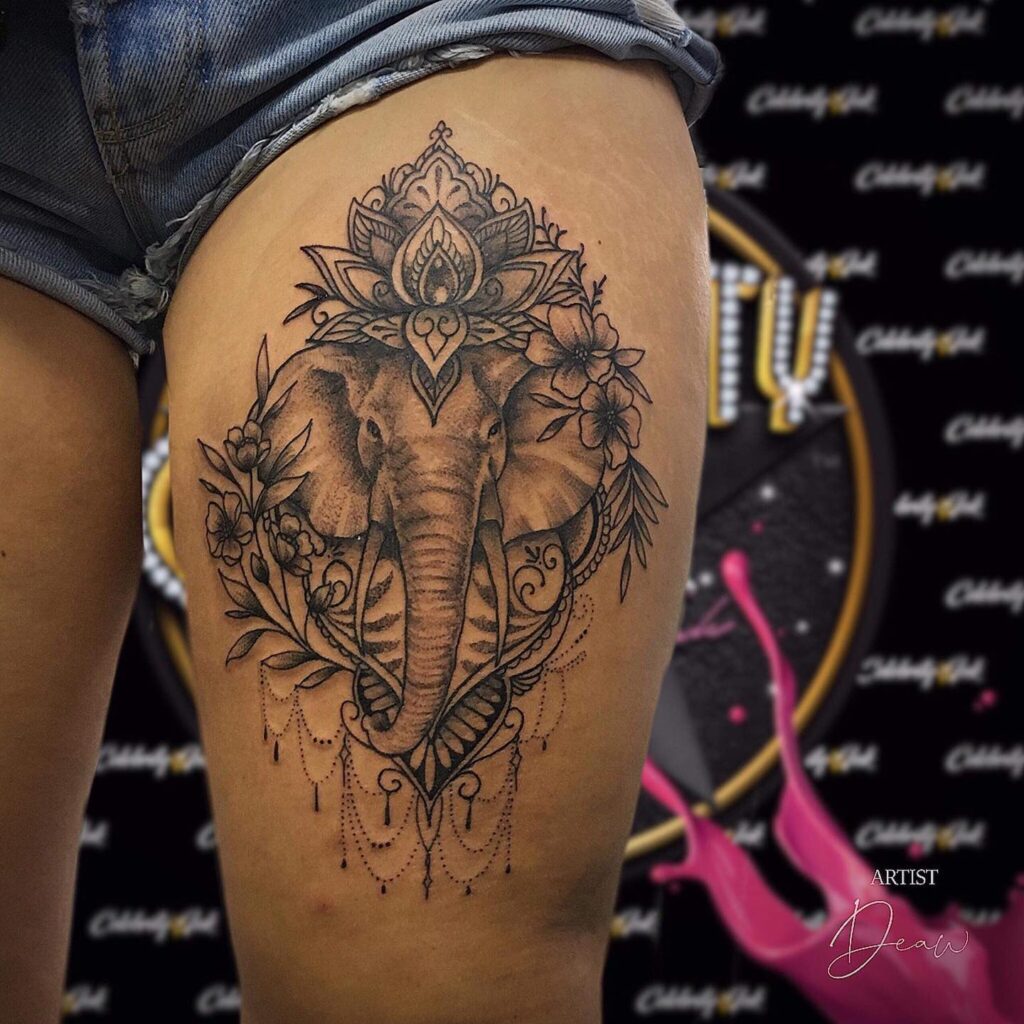 Elephant tattoo with lotus mandala and flowers