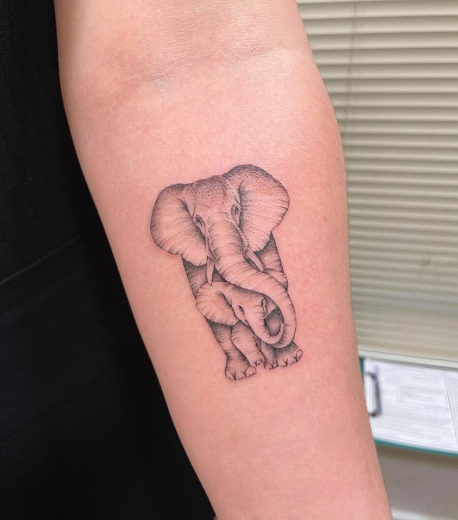 Embracing Elephants Forearm Tattoo elephant family tattoo ideas tattoo