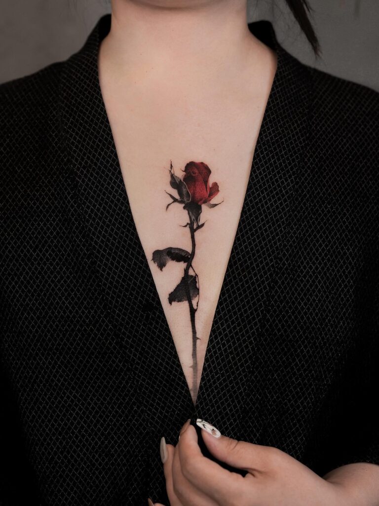 Fading Red Rose Sternum Tattoo rose tattoos for women tattoo
