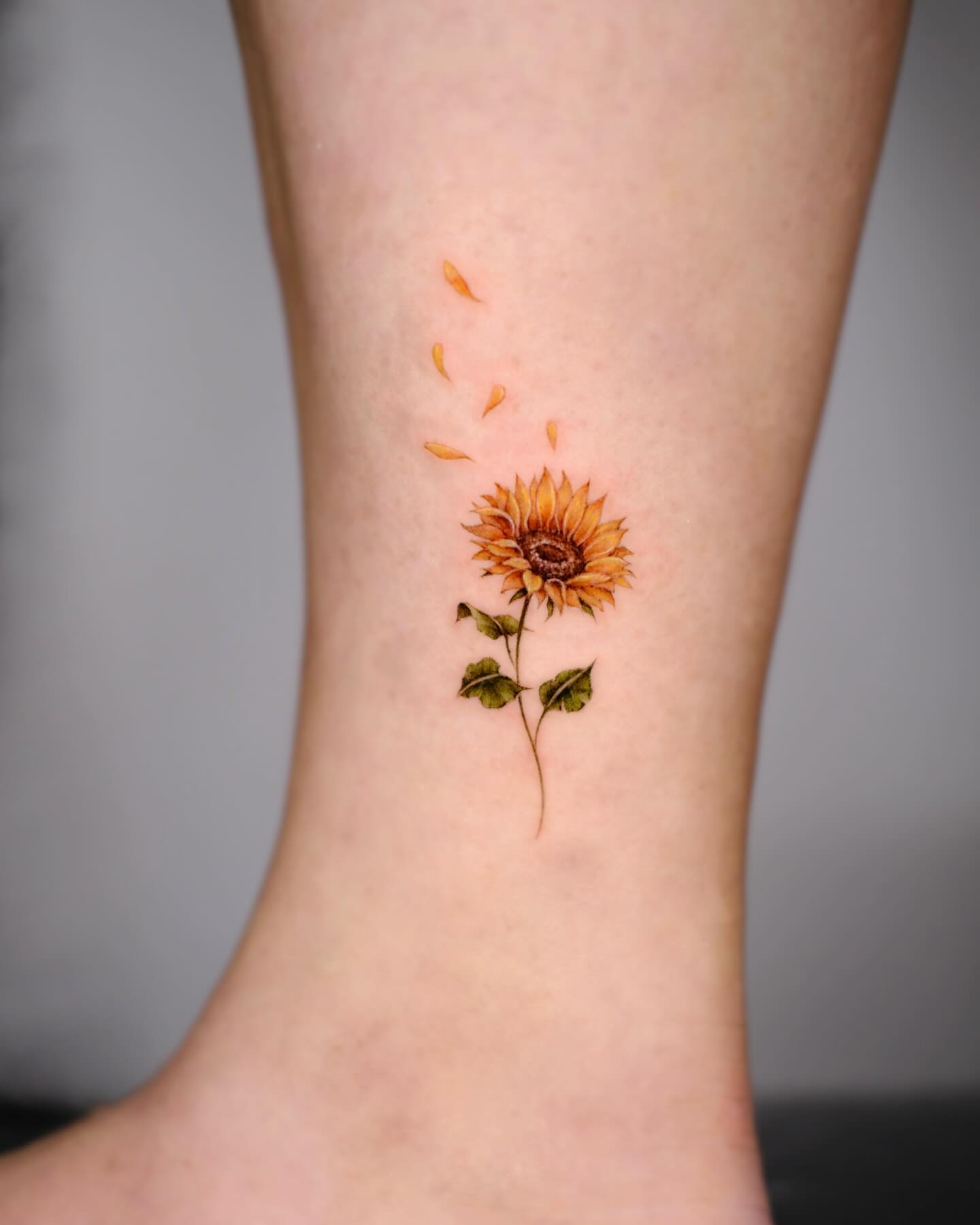 Falling Petals Sunflower Tattoo small sunflower tattoos ideas tattoo