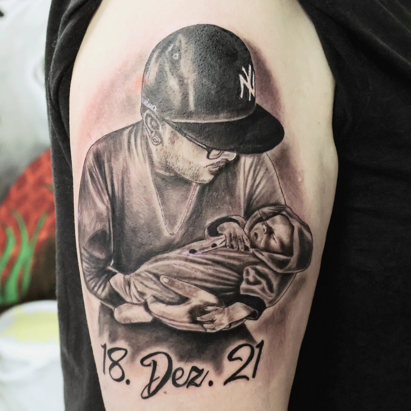 Father Holding Newborn Son Tattoo father and son tattoos tattoo