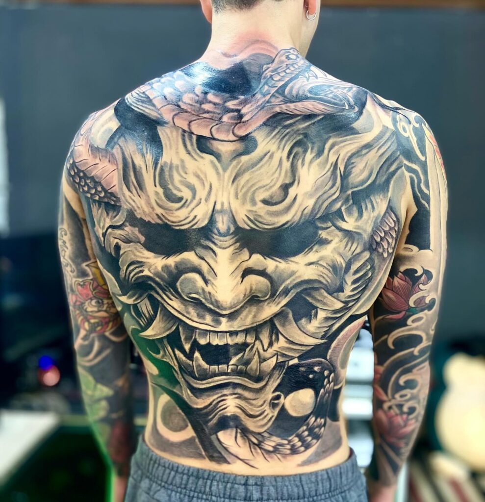 Fearsome Oni Mask and Serpent Full Back Tattoo back tattoos for guys tattoo
