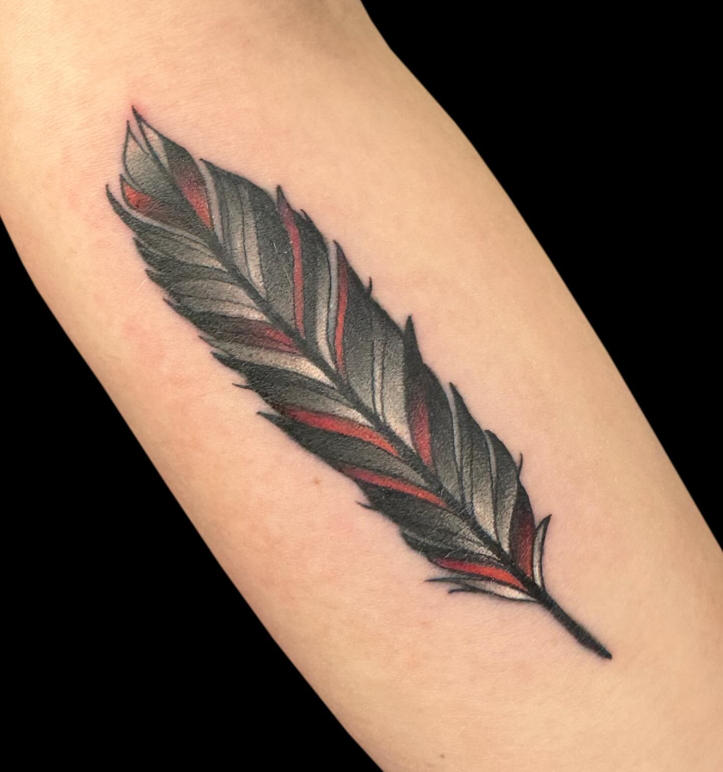 Black And Red Feather Tattoo