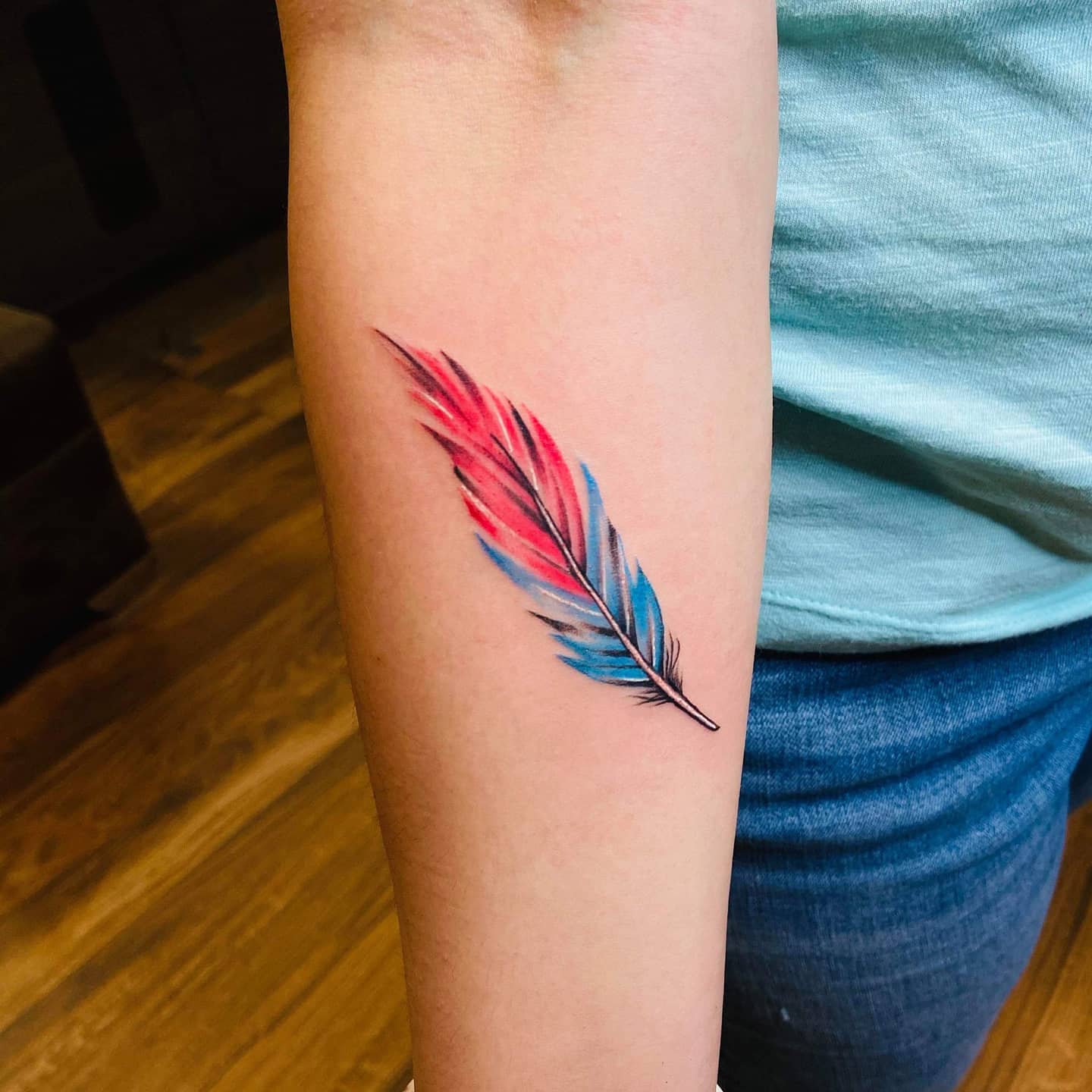 Red And Blue Feather Tattoo