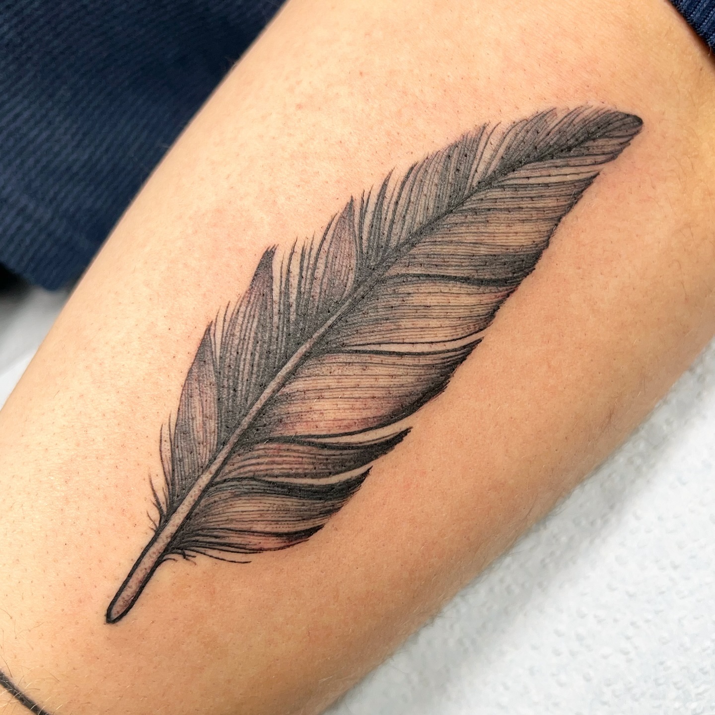 Single Feather Tattoo