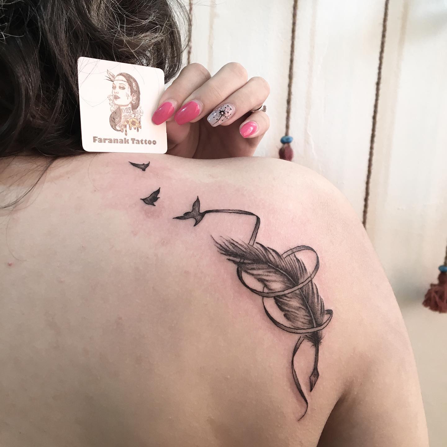 Vibrant Pink And Blue Feather Tattoo