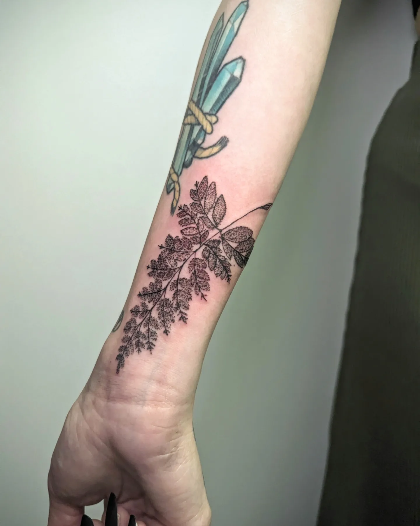 Fine Line Fern Wrist Tattoo