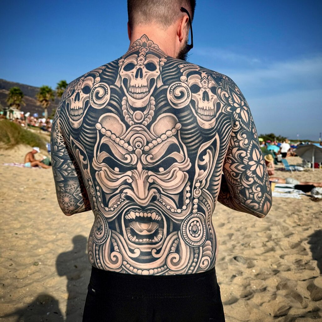 Fierce Tribal Mask and Skulls Full Back Tattoo back tattoos for guys tattoo