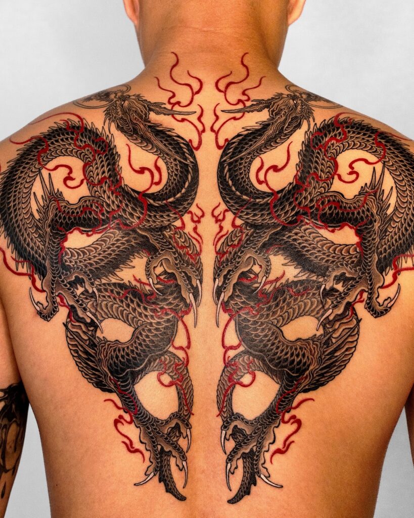 Fierce Twin Dragon Back Tattoo with Fiery Accents back tattoos for guys tattoo