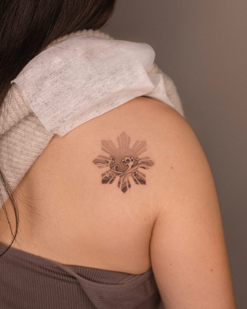 Filipino Sun with Wave Tattoo sun tattoos tattoo