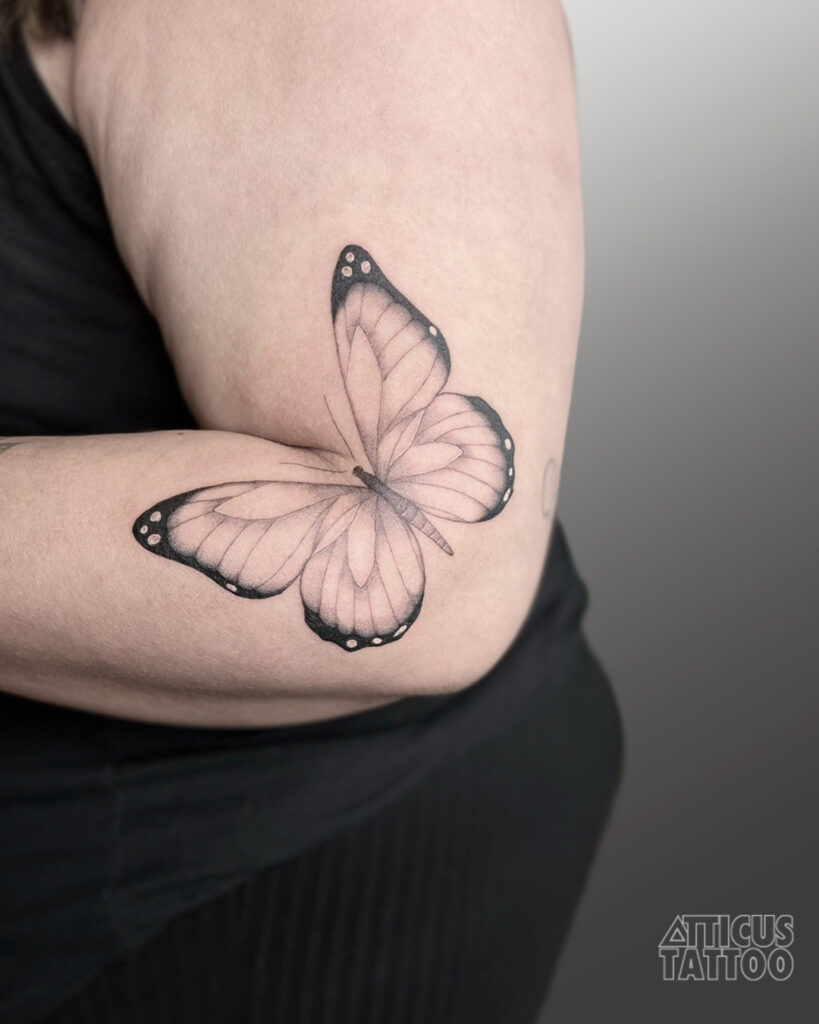 Fine Line Butterfly Resting on Wild Rose Stem butterfly tattoo