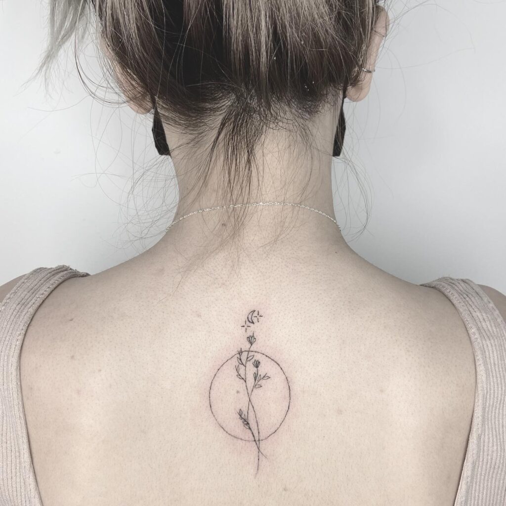 Fine Line Celestial Crescent and Botanical Bloom tattoo