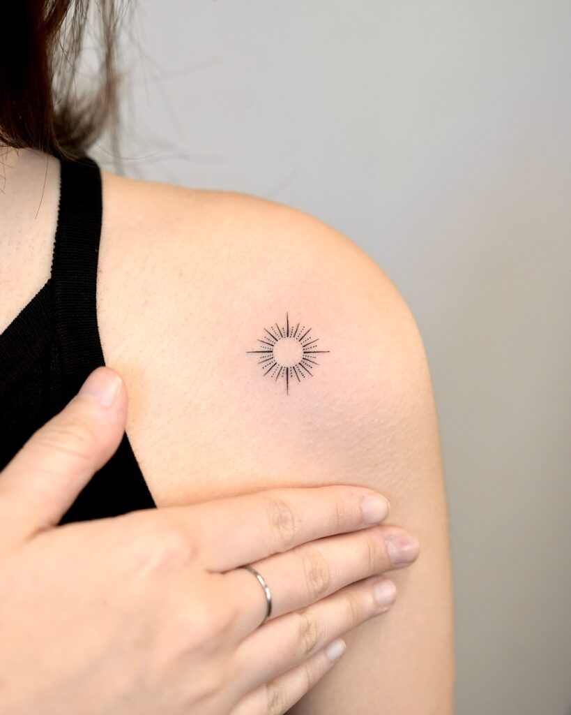 Fine Line Sunburst Shoulder Tattoo sun tattoos tattoo