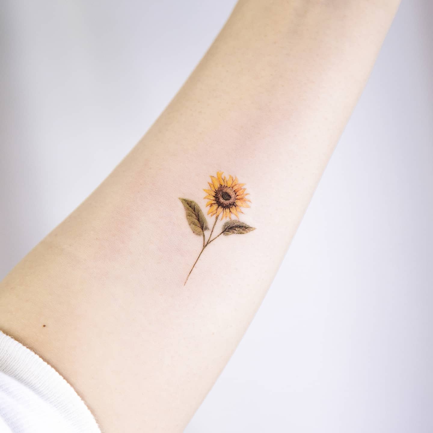 Fine Line Sunflower Branch Tattoo small sunflower tattoos ideas tattoo